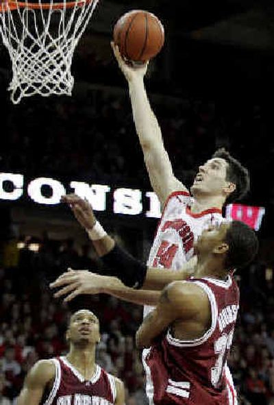 
Wisconsin's Mike Wilkinson shoots over Alabama's Jermareo Davidson during the second half of the Badgers' upset win over the 18th-ranked Crimson Tide. 
 (Associated Press / The Spokesman-Review)
