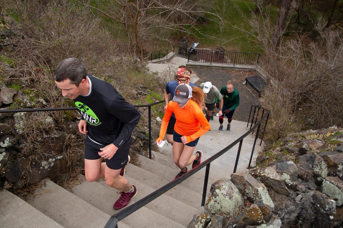 Runners on the Cliff Park stairs on the "Saint Helens Fire" route between the Perry District and Cliff Cannon Neighborhood on Tuesday, April 16, 2019. The Lantern Run Club meets every Tuesday at The Lantern Tap House. (Libby Kamrowski / The Spokesman-Review)