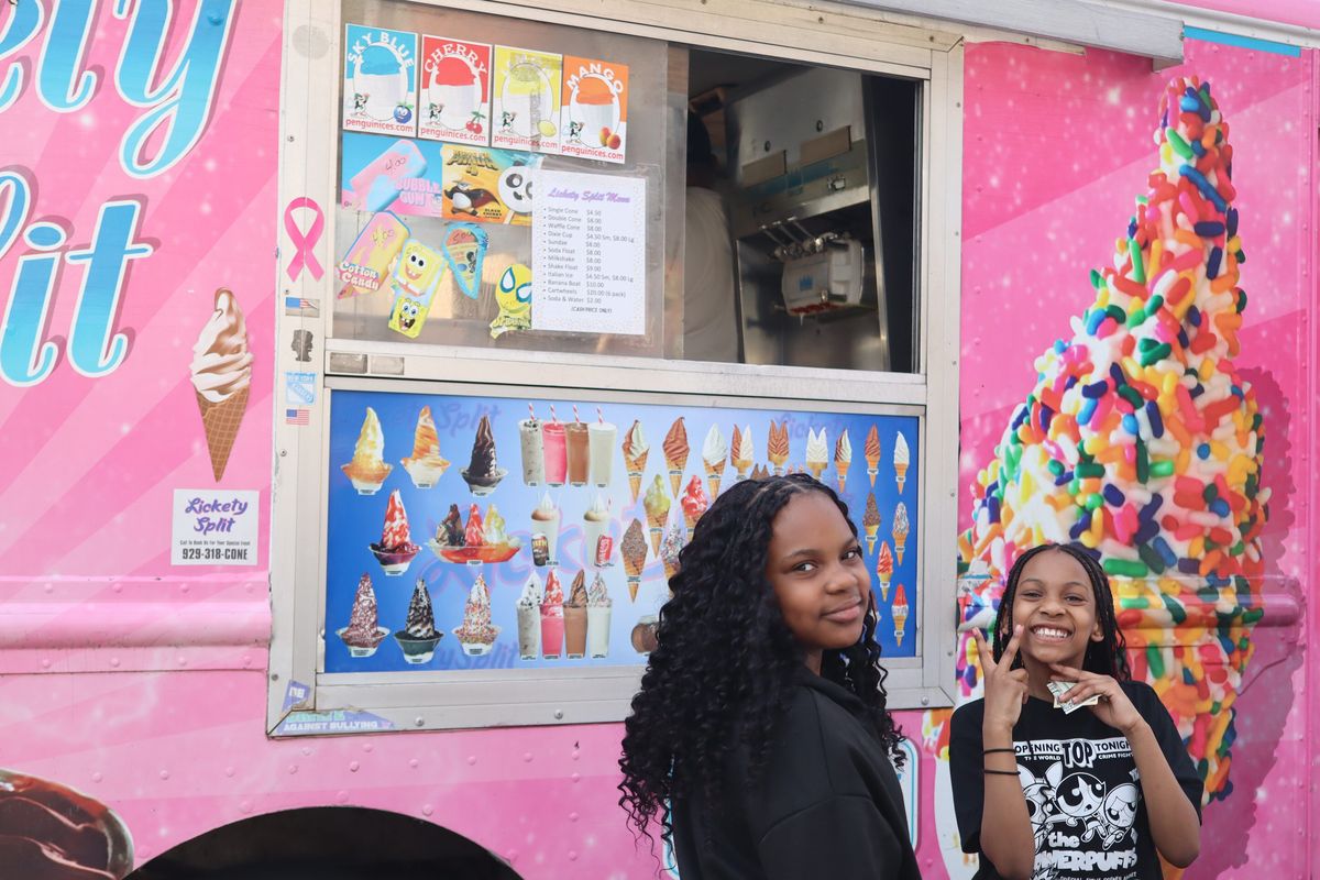 Fifth grader London Luster and her sister Lauryn, who is in third grade, order ice cream in front of Zach