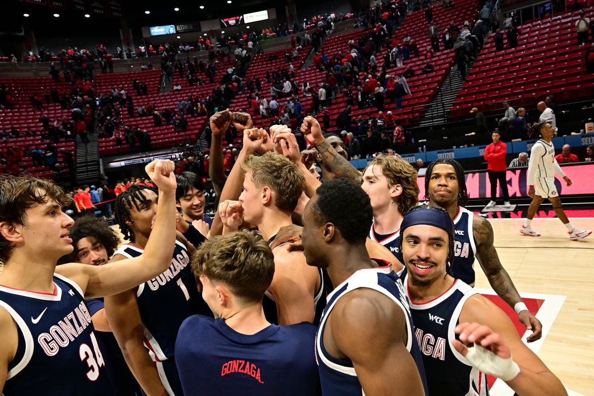 The Gonzaga Bulldogs celebrate defeating the San Diego State Aztecs during the second half of a college basketball game on Monday, Nov. 18, 2024, at Viejas Arena in San Diego, Calif. Gonzaga won the game 80-67.  (Tyler Tjomsland / The Spokesman-Review)