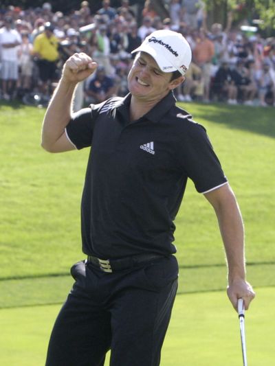 Justin Rose reacts after sinking his putt for par on the 18th hole to complete his comeback and win the Memorial golf tournament. (Associated Press)