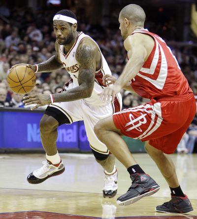LeBron James, left, led the Cavs to their fourth straight win. (Associated Press)
