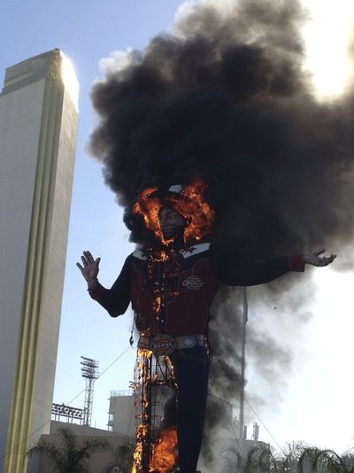 Fire engulfs the Big Tex cowboy statue displayed at the State Fair of Texas on Friday in Dallas. (Associated Press)