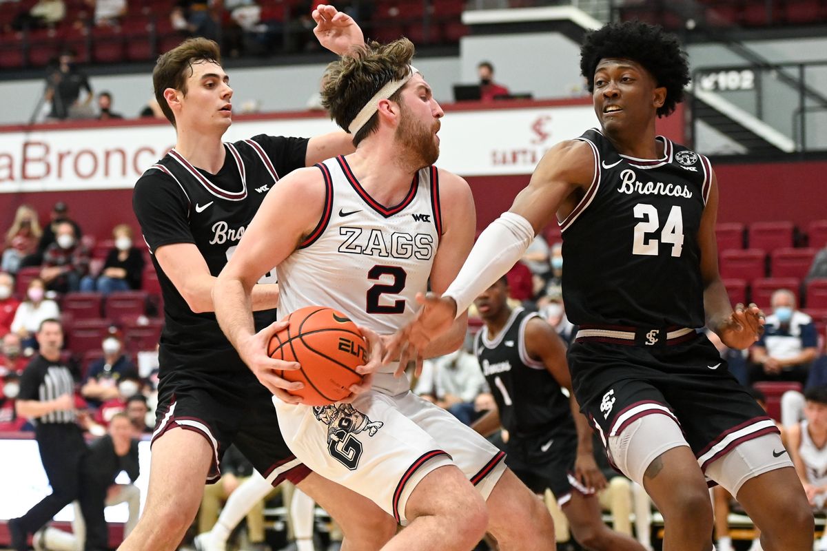 Gonzaga forward Drew Timme operates against Santa Clara guard Jalen Williams (24) and forward Parker Braun in the Zags’ win Saturday.  (Tyler Tjomsland/The Spokesman-Review)