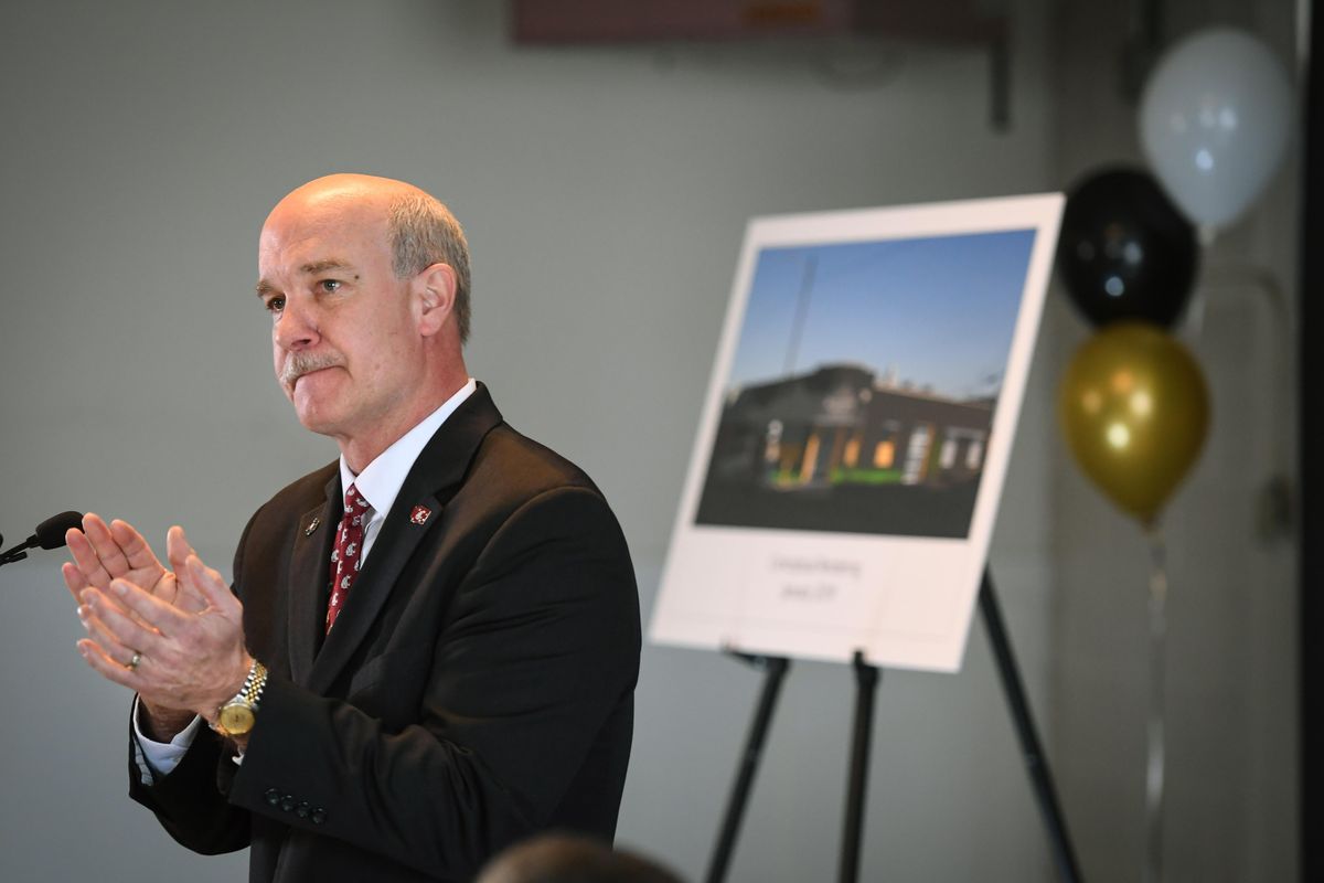 WSU Health Sciences Chancellor Daryll DeWald applauds all those involved with establishing the Steve Gleason Institute of Neuroscience during a press conference Tuesday. The institute will be located at 325 E. Sprague in Spokane. (Dan Pelle / The Spokesman-Review)