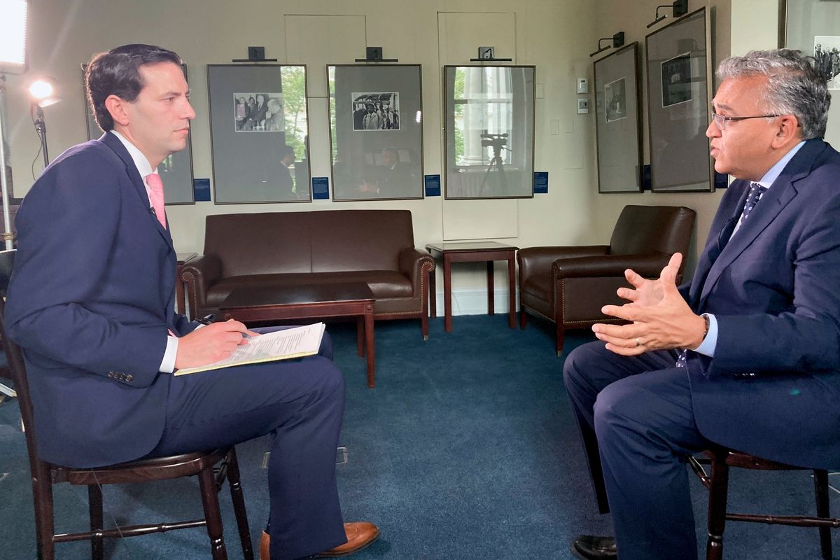 AP's Zeke Miller interviews White House COVID-19 Response Coordinator Dr. Ashish Jha, Thursday, May 12, 2022 on the White House complex in Washington. Speaking to the Associated Press, Jha said Americans' immune protection from the virus is waning and the virus is adapting to be more contagious, and that booster doses for most people will be necessary — with the potential for enhanced protection from a new generation of shots.  (Nathan Elgren)