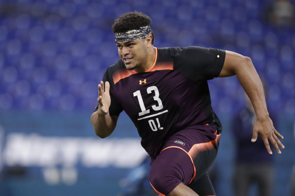 Washington State offensive lineman Andre Dillard runs a drill at the NFL Combine in Indianapolis on Friday. (Michael Conroy / AP)