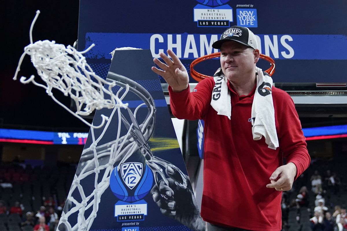 Arizona first-year head coach Tommy Lloyd cuts down the net after the Wildcats defeated UCLA in the Pac-12 Tournament title game in March.  (Associated Press)