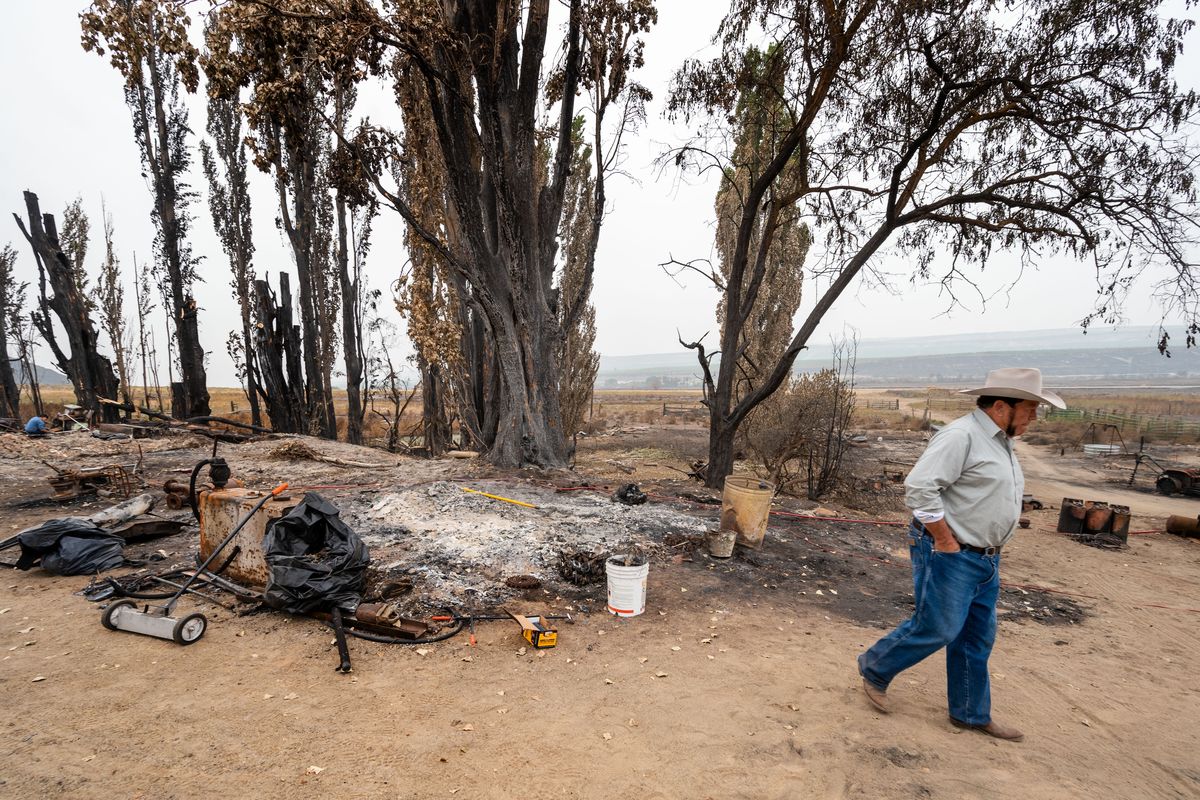 “The reality is I still have a home, but it’s just ashes,” said Jimmy Timentwa, at the site where his house was destroyed in a fast-moving wildfire in early September during the Cold Springs Fire near Omak. “I’m living in the dirt now,” he said.  (COLIN MULVANY)