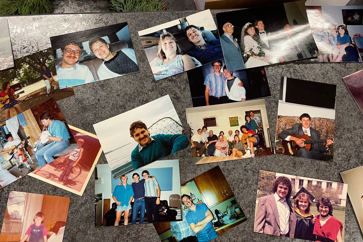A collection of photos of Douglas Brant, the in-home nurse shot and killed in December, are seen at his celebration of life at Spokane Valley Seventh-day Adventist Church on Saturday, Feb. 4, 2023.  (Nina Culver/For The Spokesman-Review)