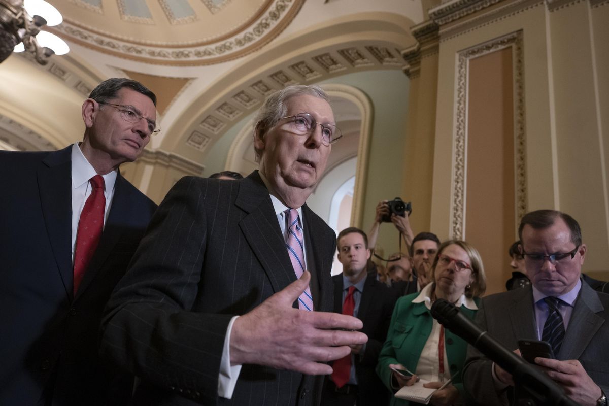 Senate Majority Leader Mitch McConnell, R-Ky., joined at left by Sen. John Barrasso, R-Wyo., speaks to reporters following a closed-door GOP policy meeting, at the Capitol in Washington, Tuesday, March 12, 2019. (J. Scott Applewhite / Associated Press)