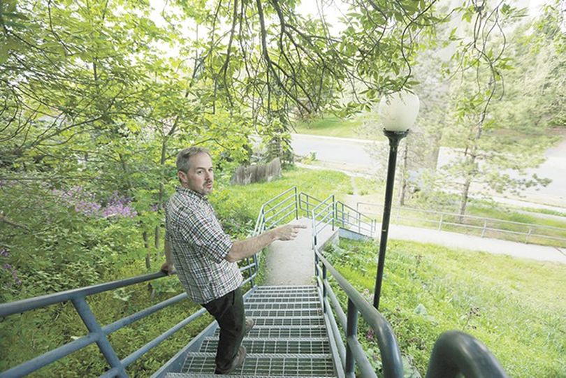 Tod Marshall strolls his Peaceful Valley neighborhood during a rare respite in his schedule as Washington's poet laureate. (Young Kwak/Inlander photo)