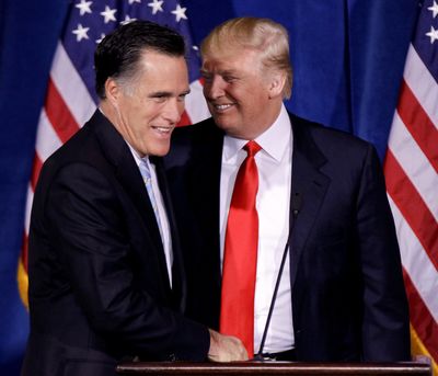 Donald Trump greets Republican presidential candidate, former Massachusetts Gov. Mitt Romney, during a news conference in Las Vegas on Feb. 2. (Associated Press)