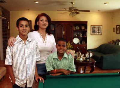 
Asthma sufferer Nicholas Garzon, 13, of Kendall, Fla., shown with his mother Gina Garzon, and brother Christopher, 8, improved after an air-cleaning system was installed in their home. 
 (Associated Press / The Spokesman-Review)