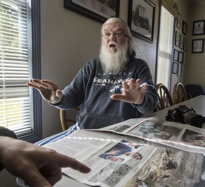 Larry Taylor, who survived the Oso mudslide, talks March 31 about the moments after the landslide hit and the photos he took of the helicopter rescue that took place near his home. (Steve Ringman)