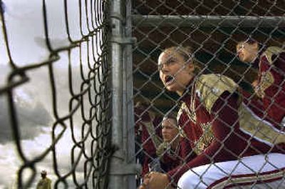 University's Tonya Schnibbe encourages a teammate during a GSL softball game last week.
(Christopher Anderson/ / The Spokesman-Review)