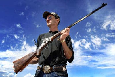 
Kirk Bryan, president of the Shiloh Sharps Rifle Manufacturing Co., poses with an 1874 model Creedmoor rifle. Bryan's company crafts the only Sharps rifles in the world in which the parts still fit the originals, made more than 100 years ago. 
 (Associated Press / The Spokesman-Review)