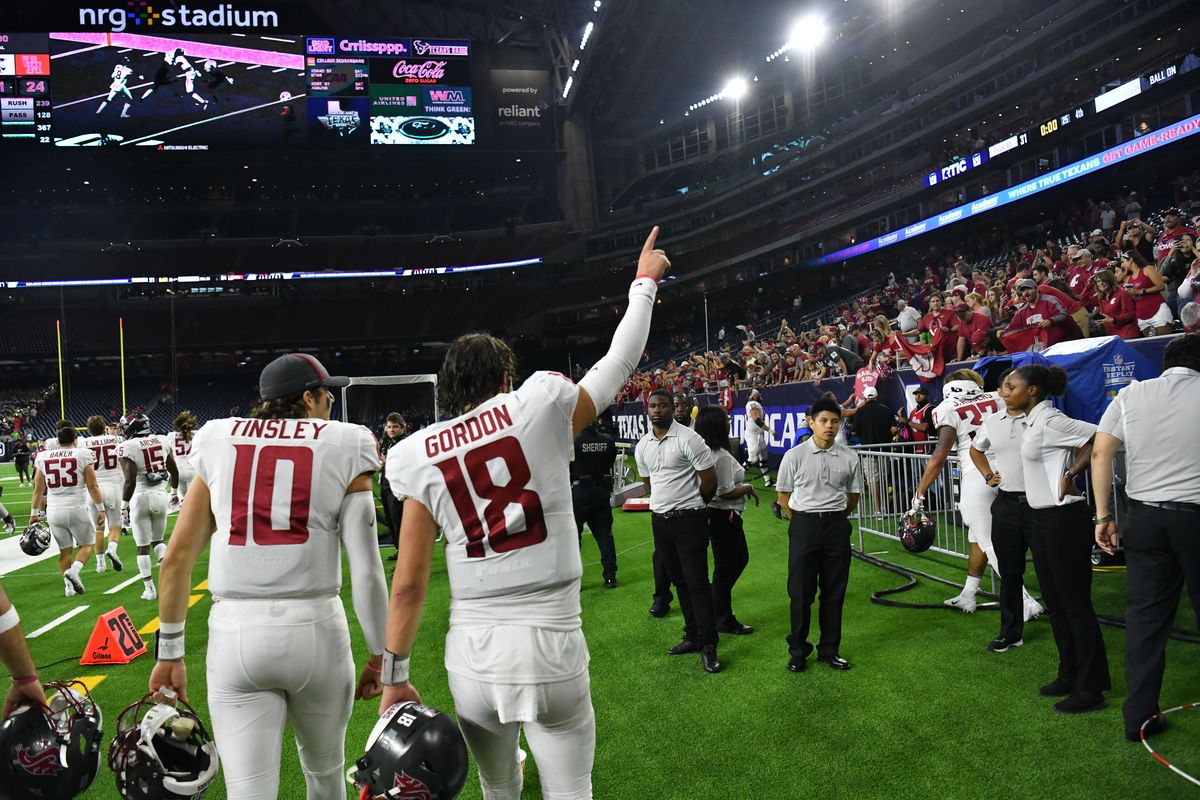 Washington State quarterback Anthony Gordon (18) salutes the crowd after WSU defeated the Houston Cougars on Friday, Sept. 13, 2019, at NRG Stadium in Houston. (Tyler Tjomsland / The Spokesman-Review)