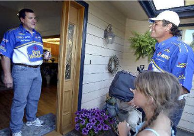 
Michael Waltrip and his daughter Macy deliver pizza to Ken Wood, left.
 (PR News Foto / The Spokesman-Review)