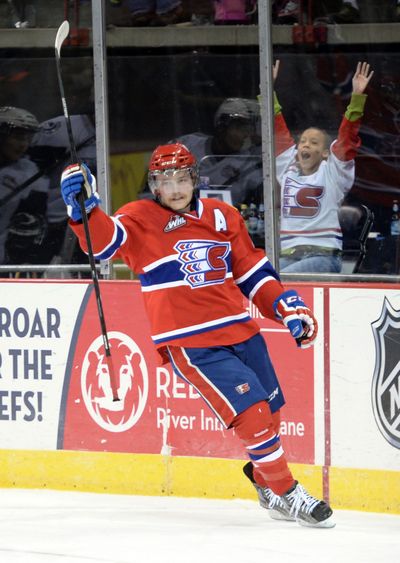 Mitch Holmberg of the Spokane Chiefs celebrates the first goal of the night against the Saskatoon Blades in the first period at the Spokane Arena on Wednesday night. Holmberg scored again in the first period as the Chiefs beat the Blades 2-1.  (Jesse Tinsley)