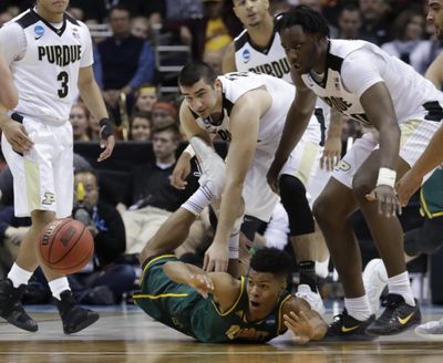 Vermont’s Trae Bell-Haynes goes after a loose ball during the second half of an NCAA college basketball tournament first-round game against Purdue Thursday, March 16, 2017, in Milwaukee. Purdue won 80-70. (Morry Gash / Associated Press)