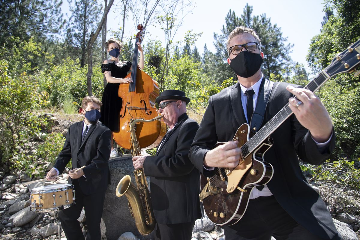 Rockabilly Space Force, photographed Monday, July 6, 2020 at High Bridge Park by the Spokane River, is a band made up of Robert Folie on sax, Garrin Hertel on guitar and vocals, Andy Bennet on drums and Olivia Brownlee on bass and vocals. It is a newer project of Hertel, who has led Hot Club of Spokane and its newer iteration, the Zonky Jazz Band.  (Jesse Tinsley/The Spokesman-Review)