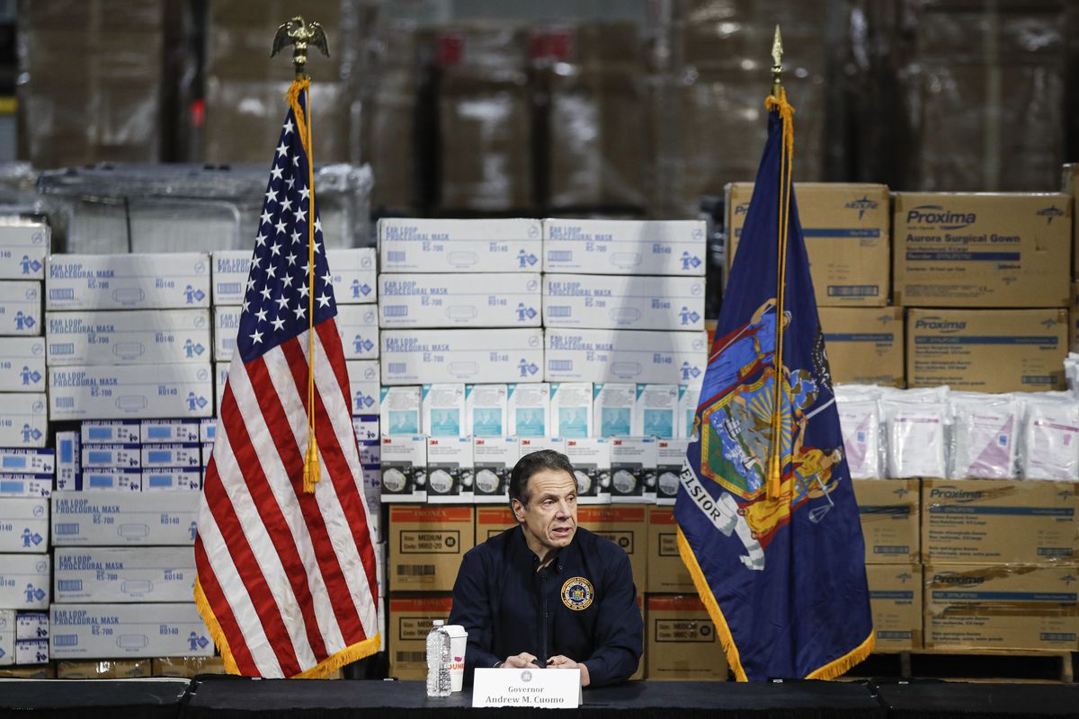 In this March 24, 2020 photo, Gov. Andrew Cuomo speaks during a news conference against a backdrop of medical supplies at the Jacob Javits Center that will house a temporary hospital in response to the COVID-19 outbreak in New York. (John Minchillo)