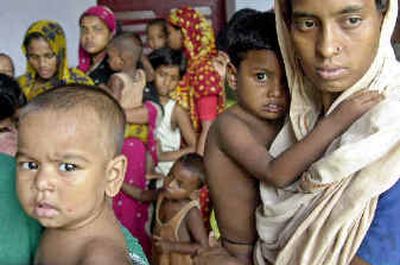 
Bangladeshi flood victims stand in line Saturday for medical aid after being afflicted by waterborne diseases at a makeshift camp in Dhaka's Armanitola district, Bangladesh.Bangladeshi flood victims stand in line Saturday for medical aid after being afflicted by waterborne diseases at a makeshift camp in Dhaka's Armanitola district, Bangladesh.
 (Associated PressAssociated Press / The Spokesman-Review)