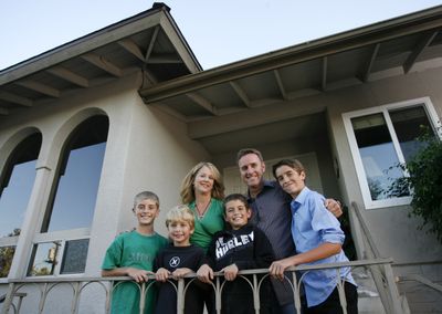Robert and Celeste Blodgett, background, pose with their four sons, from left, Garrett, 12, Mark, 7, Matthew, 9, and Zachary, 14, at their home in El Cajon, Calif. However rough things might get when raising teenagers, parents can’t just give up, Robert Blodgett says.  (Associated Press / The Spokesman-Review)