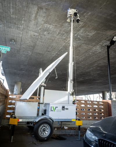 The Spokane City Council has approved the purchase of eight pole mounted cameras for police investigative duties. Unlike this mobile camera unit pictured near Lewis and Clark High School in February 2023, the cameras will be attached to pre-existing light and utility poles – and four of them will be disguised. (COLIN MULVANY/THE SPOKESMAN-REVIEW)