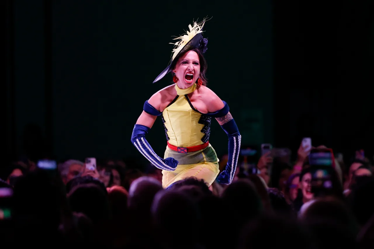 Republic, Washington, fashion designer, Margaret Kidwell, strikes a menacing mutant pose on the runway during the 2024 Her Universe Fashion Show in San Diego. (Meg McLaughlin/San Diego Union-Tribune)