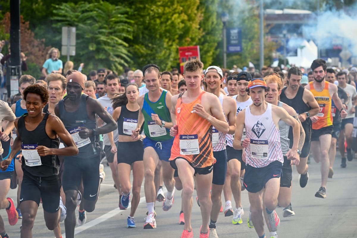 The Boulevard Race elite runners break from the start line and through the smoke cloud to begin the 4-mile course on Spokane Falls Boulevard, Sunday, Sept 21, 2025, in Spokane. (DAN PELLE/FOR THE / SPOKESMAN-REVIEW)