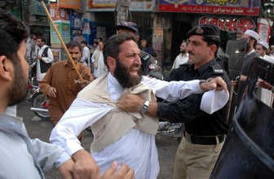 
Police arrest a protester Thursday during a rally against President Gen. Pervez Musharraf in Peshawar, Pakistan. A major opposition rally was set for today in Rawalpindi. Associated Press
 (Associated Press / The Spokesman-Review)