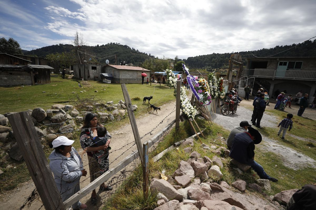 Mourners watch from outside the overflowing church where the funeral service for community activist Homero Gomez Gonzalez is held in Ocampo, Michoacan state, Mexico, Friday, Jan. 31, 2020. Hundreds of farmers and agricultural workers attended the funeral Friday, and the homage to the anti-logging activist was like a tribute to the monarch butterfly he so staunchly defended. (Rebecca Blackwell / Associated Press)