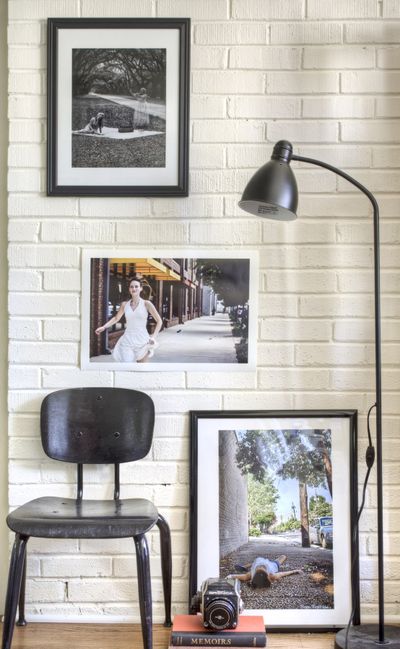 Designer Brian Patrick Flynn suggests painting interior brick white or cream for a softer, sophisticated industrial aesthetic. This allows homeowners to work with a wider range of color palettes and helps cherished items such as art or heirlooms to stand out.