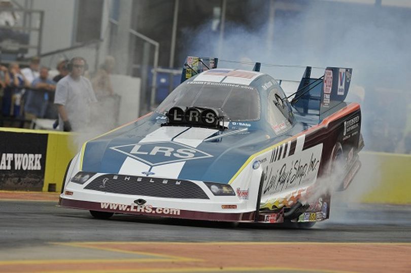 Tim Wilkerson blazes to the top of the Funny Car qualifying ladder in Dallas. (Photo courtesy of NHRA)