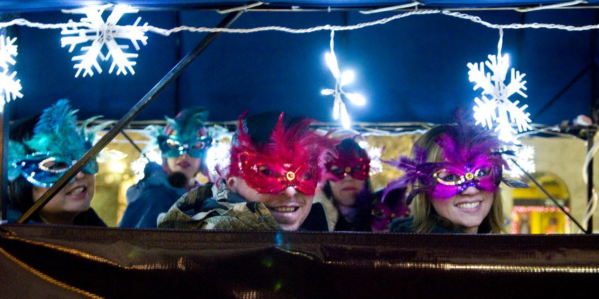 At the start of First Night 2008, Bo Kirk, center, and his wife Amanda Kirk, far right, enjoy a horse and carriage ride that lead the STCU-Masquerade Parade from the Spokane Convention Center to downtown. (Colin Mulvany / The Spokesman-Review)