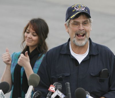 Capt. Richard Phillips smiles after arriving in South Burlington, Vt., on Friday. Phillips is back in his home state, a week and a half after being taken hostage by pirates. At rear is his daughter Mariah.  (Associated Press / The Spokesman-Review)