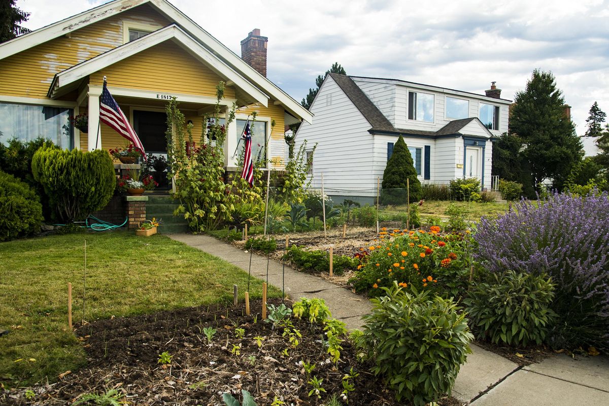 Kathleen Callum and Robert Sloma have replaced most of their front lawn with a vegetable garden, knowing that it