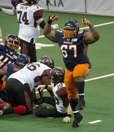Spokane’s Terrance Taylor (67) dances after sacking Shane Austin. (Dan Pelle)