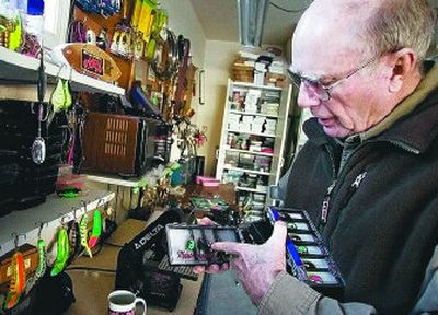 
Phil Rabideau shows off some of the Mepps spinners he has worked on over the years in his home garage workshop in Vancouver, Wash. 
 (Associated Press / The Spokesman-Review)