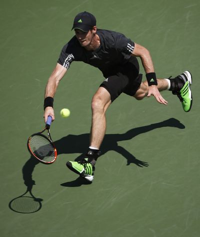 Eighth-seeded Andy Murray returns a shot on Monday. (Associated Press)