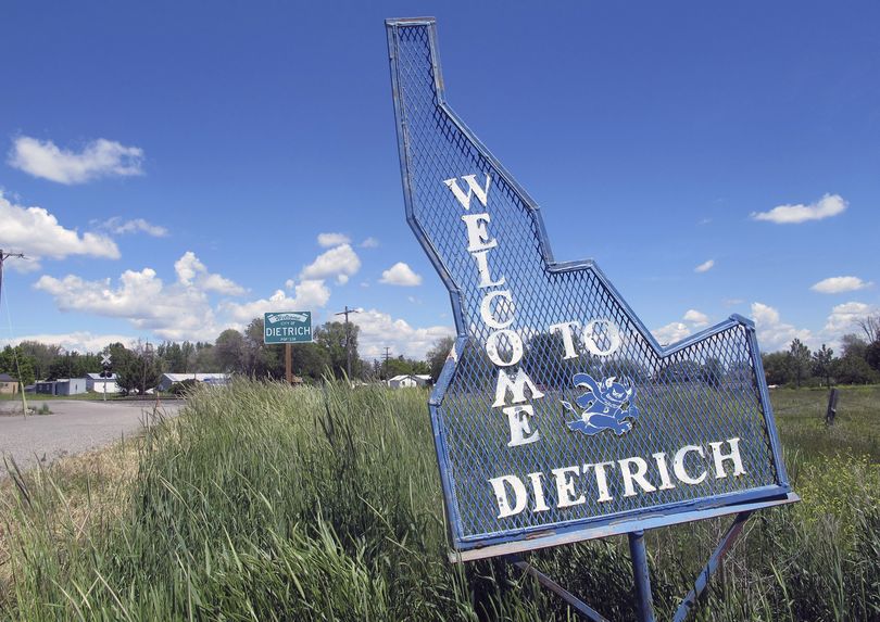  In this May 26, 2016, file photo, a sign welcomes residents and visitors to the tiny town in Dietrich, Idaho. The small community has faced national attention after a $10 million federal lawsuit was filed alleging the local school did nothing to prevent months of racist and sexual abuse of a disabled black teen. Lee Schlender, the victim's attorney, confirmed Monday, Oct. 2, 2017, that a monetary settlement had been reached with the Dietrich School District, but declined to share details regarding the amount and terms of the agreement.  (AP / Kimberlee Kruesi)