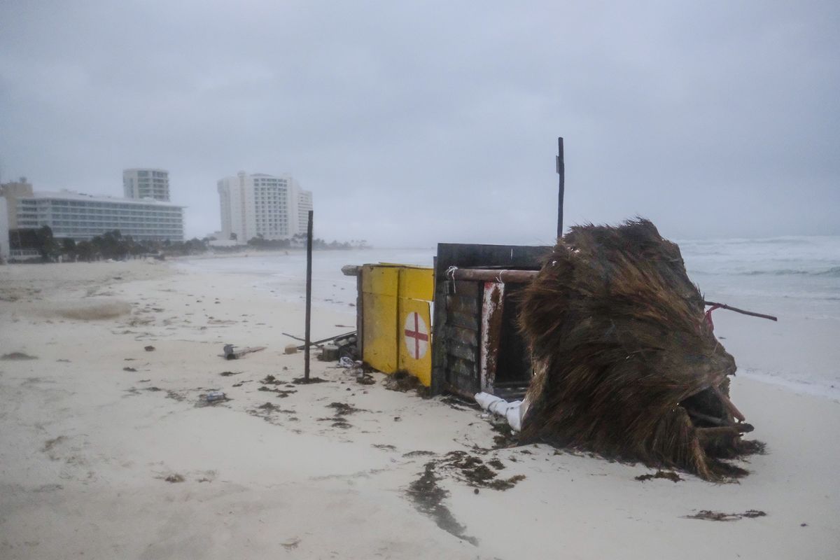 A lifeguard tower lays on its side after it was toppled over by Hurricane Delta on Wednesday in Cancun, Mexico.  (Victor Ruiz Garcia)