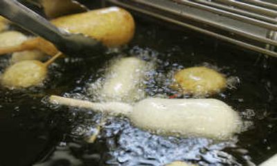 
A Milky Way candy bar is deep-fried at Jeremy Orme's food booth at the Indiana State Fair in Indianapolis on Wednesday. Associated Press
 (Associated Press / The Spokesman-Review)