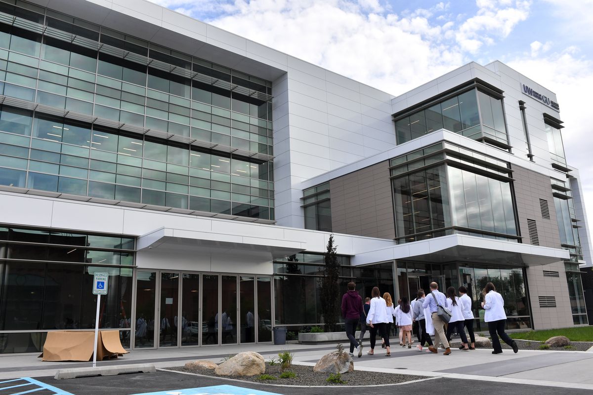 Students attending the University of Washington-Gonzaga University Health Partnership tour its 840 building in June 2022. Now, the UW School of Dentistry for its Regional Initiatives in Dental Education, partnering with Eastern Washington University, has agreed to lease the fourth floor and construct an oral health training center for expanding this summer and having more students train to become dentists, primarily for rural areas. (Tyler Tjomsland/The Spokesman-Review)