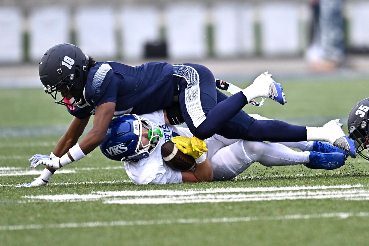 Gonzaga Prep’s Matthew Getahun stops Curtis’ Ryland Geldermann short of a first down on Saturday at Bullpup Stadium. (James Snook)