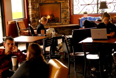 Customers at The Service Station coffeehouse are busy Monday with lattes and conversation in Spokane. (Brian Plonka / The Spokesman-Review)