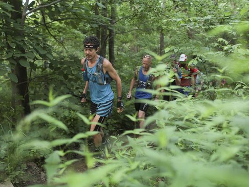 Scott Jurek, 41, runs on the McAffee Knob Trail portion of the Appalachian Trail in Catawba, Virginia, on June 11.  On July 12, he finished the AT in a record time. (John Roark / Associated Press)