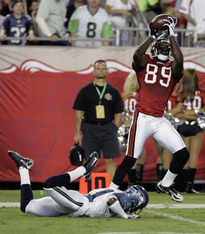 Associated Press Tampa Bay’s Antonio Bryant makes a 47-yard touchdown catch in front of Kelly Jennings on Sunday. (Associated Press / The Spokesman-Review)